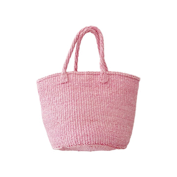 A pink woven straw tote bag with two rope handles, shown against a plain white background.