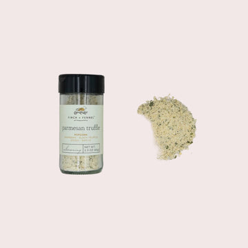 Bottle of parmesan truffle seasoning on a textured gray surface