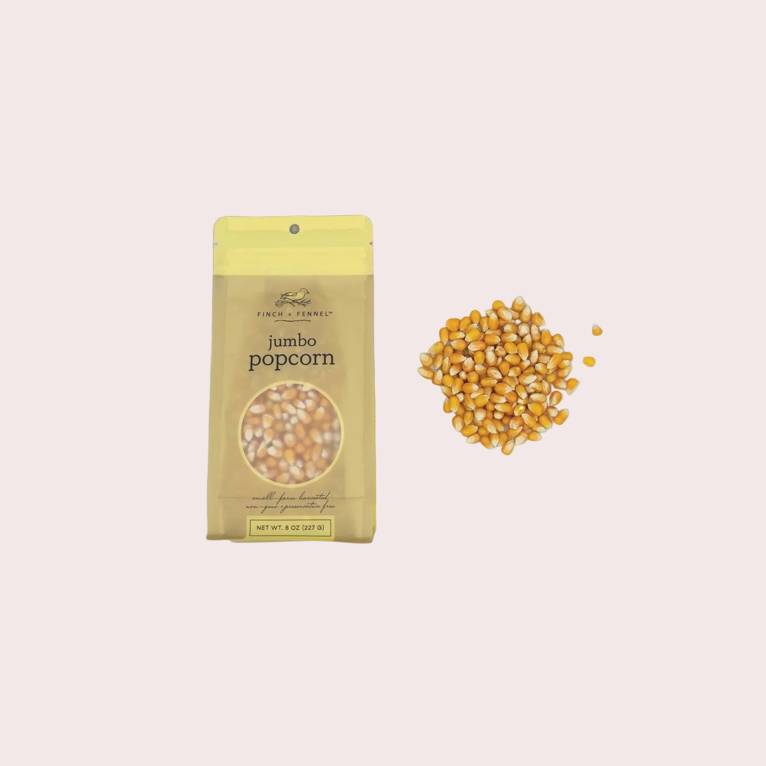 Jumbo popcorn package with unpopped kernels on a light gray background