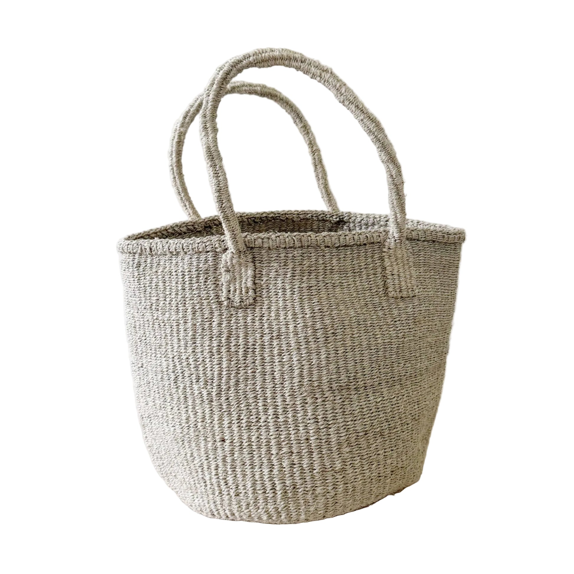 Woven basket with handles on a light background